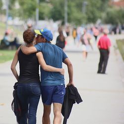 Rear view of people walking on street