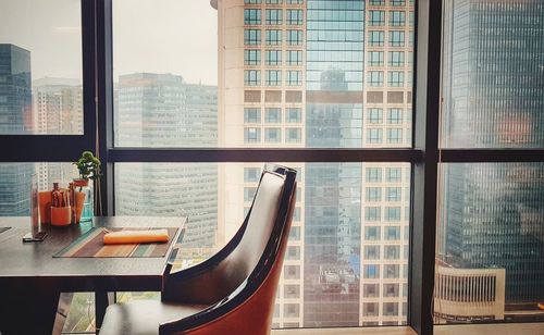 Cityscape seen through glass window