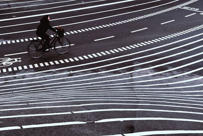 Man riding bicycle on road