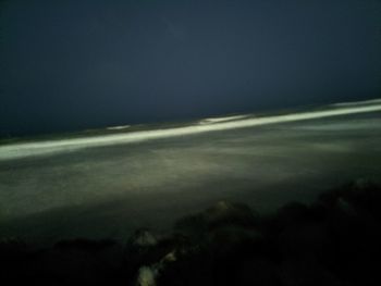 Scenic view of landscape against sky at night