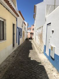 Narrow alley amidst buildings in town