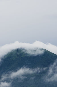 Scenic view of cloudscape and mountains against sky