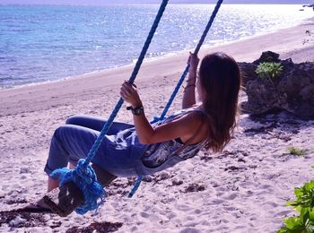 Woman sitting on beach