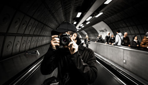 Man photographing at camera
