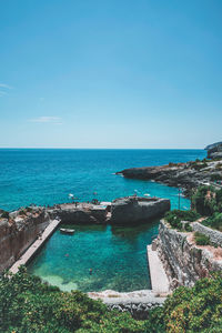 Scenic view of sea against clear blue sky