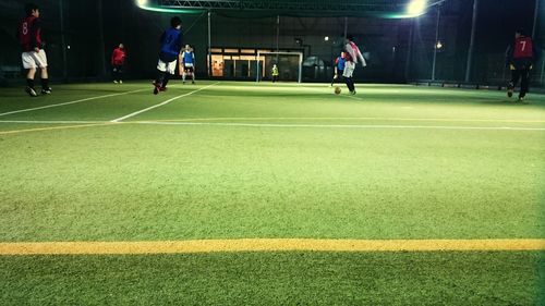 Players playing indoor soccer