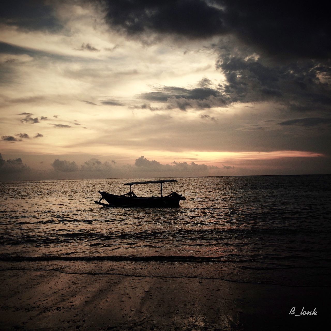 sea, nautical vessel, water, transportation, boat, mode of transport, sky, sunset, horizon over water, scenics, tranquility, tranquil scene, beauty in nature, cloud - sky, nature, silhouette, beach, travel, idyllic