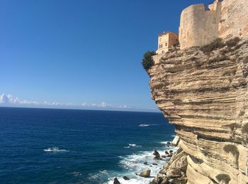 Scenic view of sea against clear blue sky