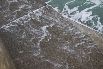 High angle view of surf on beach