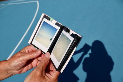 Close-up of person photographing with mobile phone