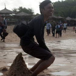 Rear view of people on beach