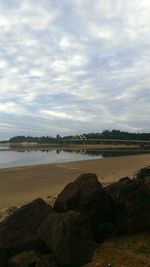 Scenic view of sea against cloudy sky