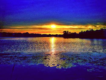 Scenic view of sunset over lake