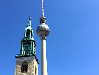 Low angle view of a building against blue sky