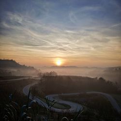 Scenic view of landscape against sky during sunset