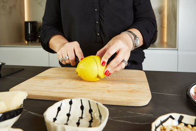 Midsection of man preparing food on table