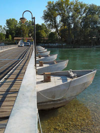 Boats in water against sky