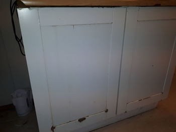 Close-up of white door of building