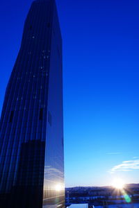 Low angle view of skyscrapers lit up at night