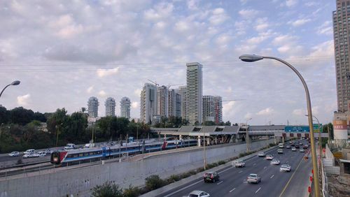 View of city against cloudy sky