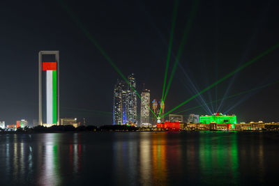 Cityscape of abu dhabi lit up for 50th golden jubilee uae national day celebrations
