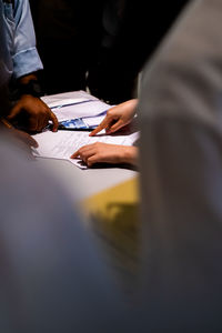 Group of people sitting on table