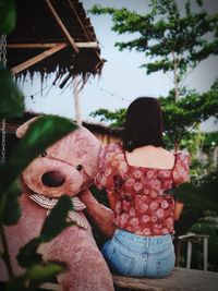 Rear view of woman standing outdoors