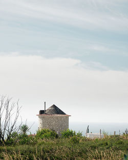 House on field against sky