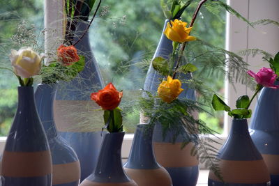 Close-up of multicolor roses in vase