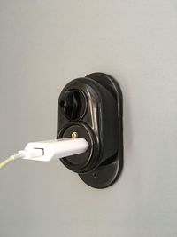 Close-up of electric charger on plug