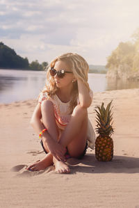 Woman sitting on beach