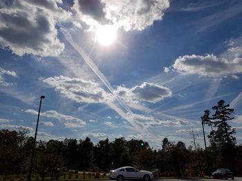 Cars on road against sky