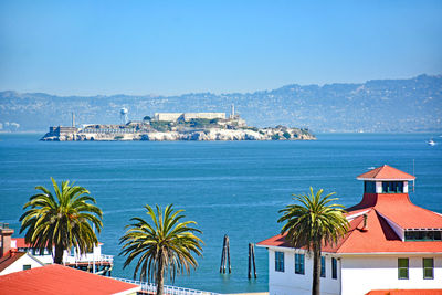 Scenic view of sea against blue sky