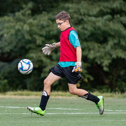 Low section of man playing with ball