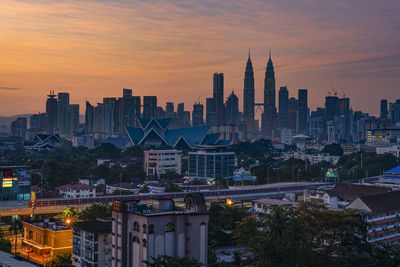 View of cityscape against sky during sunset