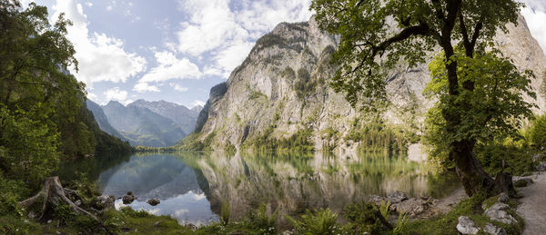 Scenic view of lake and mountains against sky