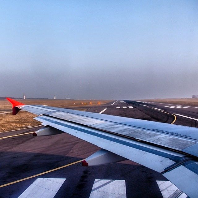 transportation, airplane, aircraft wing, mode of transport, air vehicle, cropped, part of, public transportation, flying, sky, travel, copy space, airport, journey, on the move, clear sky, no people, day, mid-air, airport runway