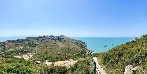 Scenic view of sea against clear blue sky