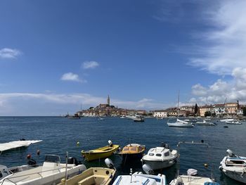 Boats in sea against sky at rovinj