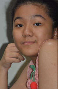 Close-up portrait of smiling young woman