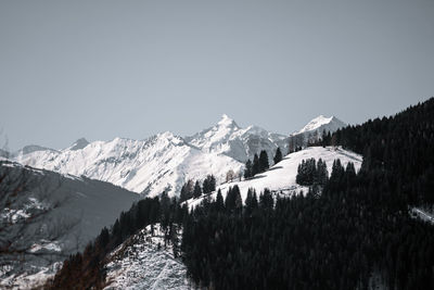 Panoramic view of snowcapped mountains against clear sky