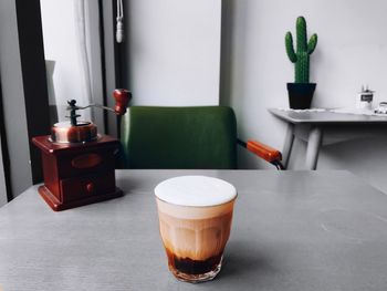 Close-up of coffee in glass on table