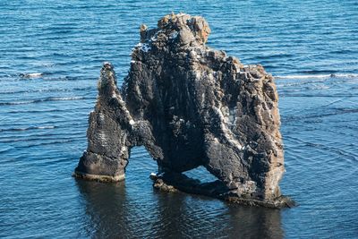 High angle view of rock formation in sea