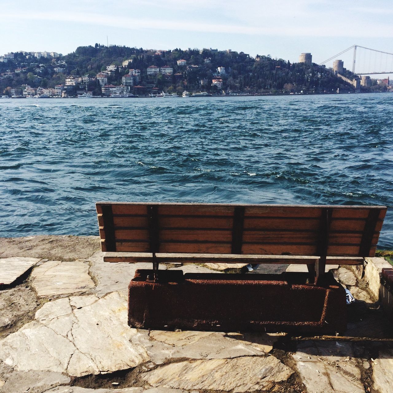 water, built structure, building exterior, architecture, sea, sky, river, mountain, day, city, rippled, outdoors, nature, tranquility, no people, scenics, lake, pier, rock - object, tranquil scene