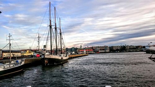 Boats moored at harbor