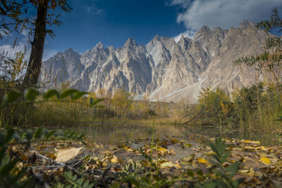 Scenic view of landscape and mountains against sky
