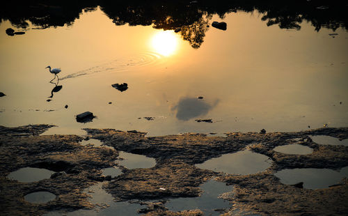 High angle view of lake against sky during sunset