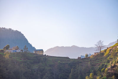 Panoramic shot of buildings against clear sky