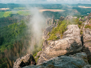 Morning rocky park from top of schrammsteine rocks vantage point above bad schandau, saxony, germany