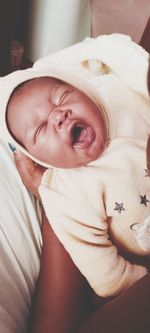Portrait of cute baby girl with eyes closed